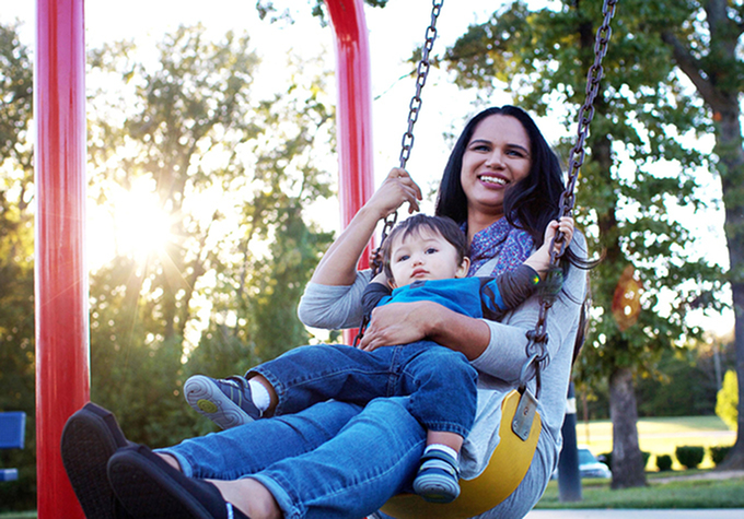 Mother and son on a swing