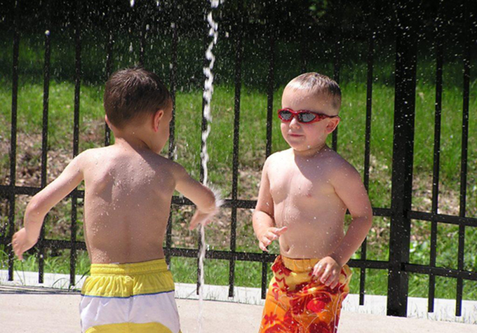 Get the Most from Your BAH | 2 children playing at a splash pad