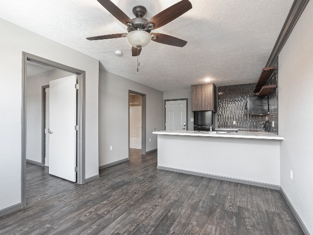living room apartment with dark gray hardwood flooring at northgate apartments