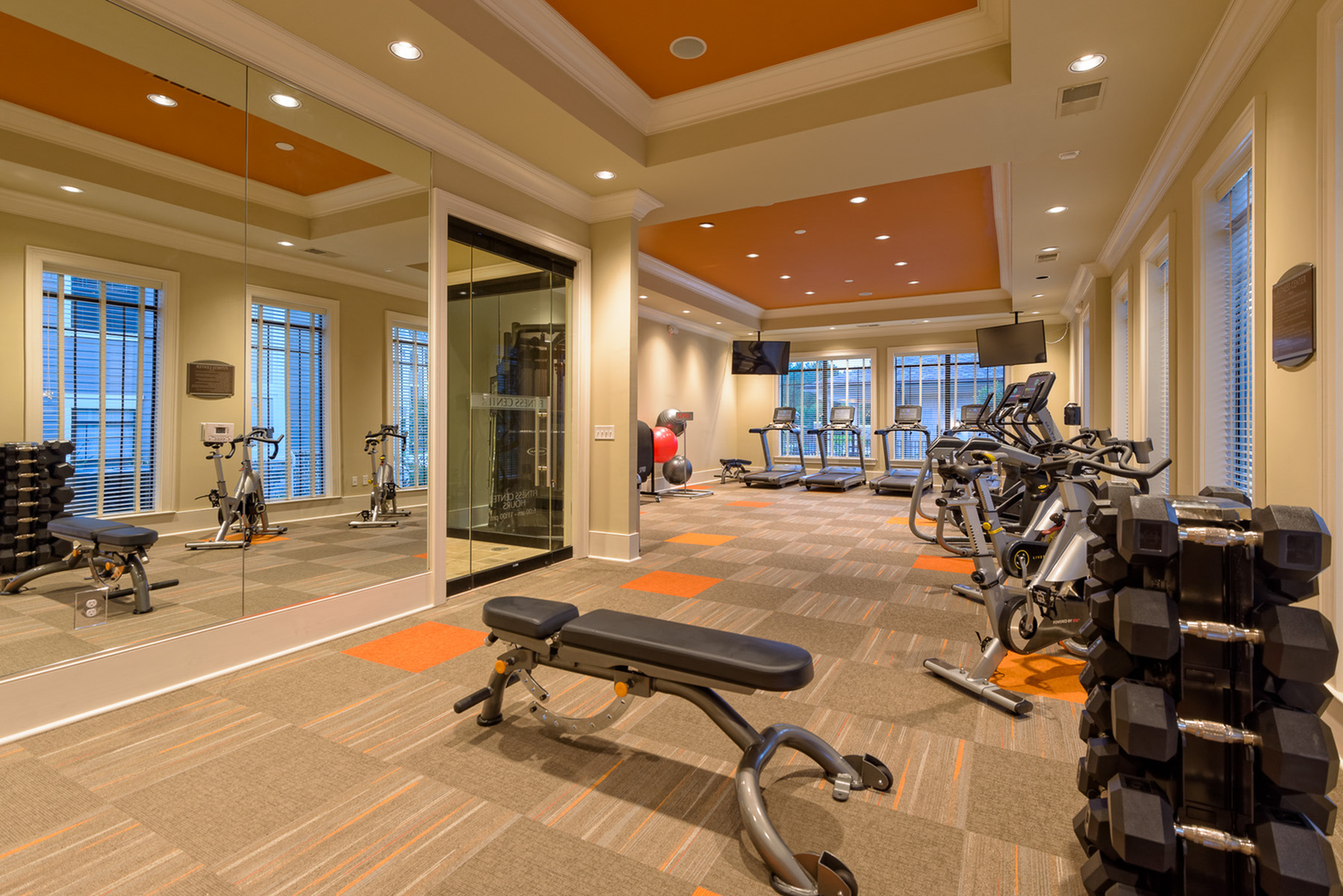 View of Fitness Center, Showing Free Weights, Bench, and Cardio Machines at Heights at Meridian Apartments