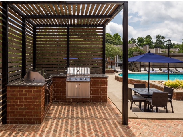 View of Grilling Lounge, Showing Grills, Pergola, and Picnic Area at Retreat at Peachtree City Apartments