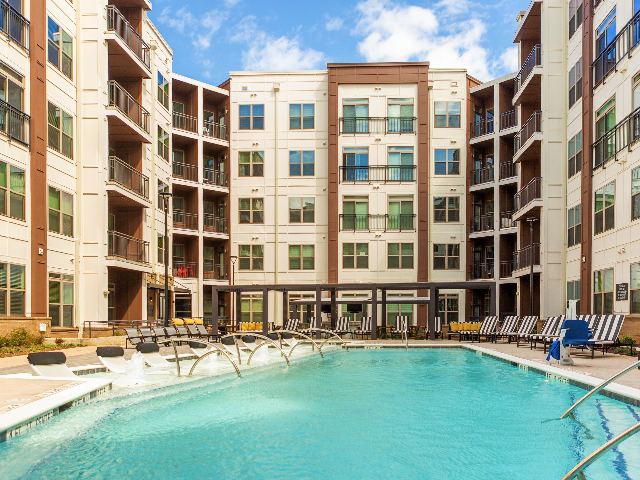 Enjoy Our Saltwater Pool, With View of Louners, Pergola, and Sun Deck at Alton Optimist Park Apartments