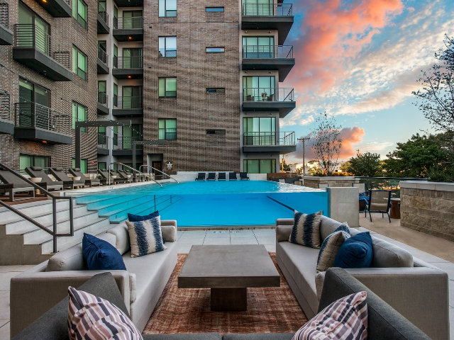 Enjoy Our Sundeck, With View of Elevated Swimming Pool and Seating Areas at The Hudson Apartments