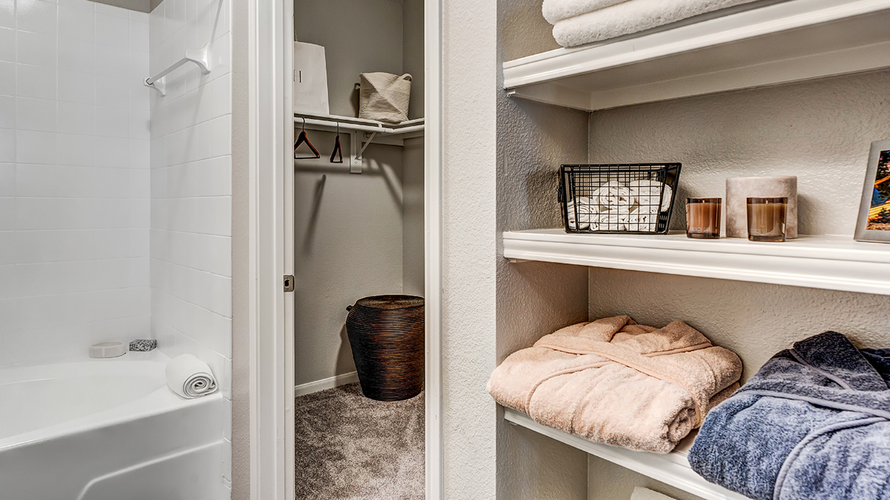 Shelving for linens located in the bathroom
