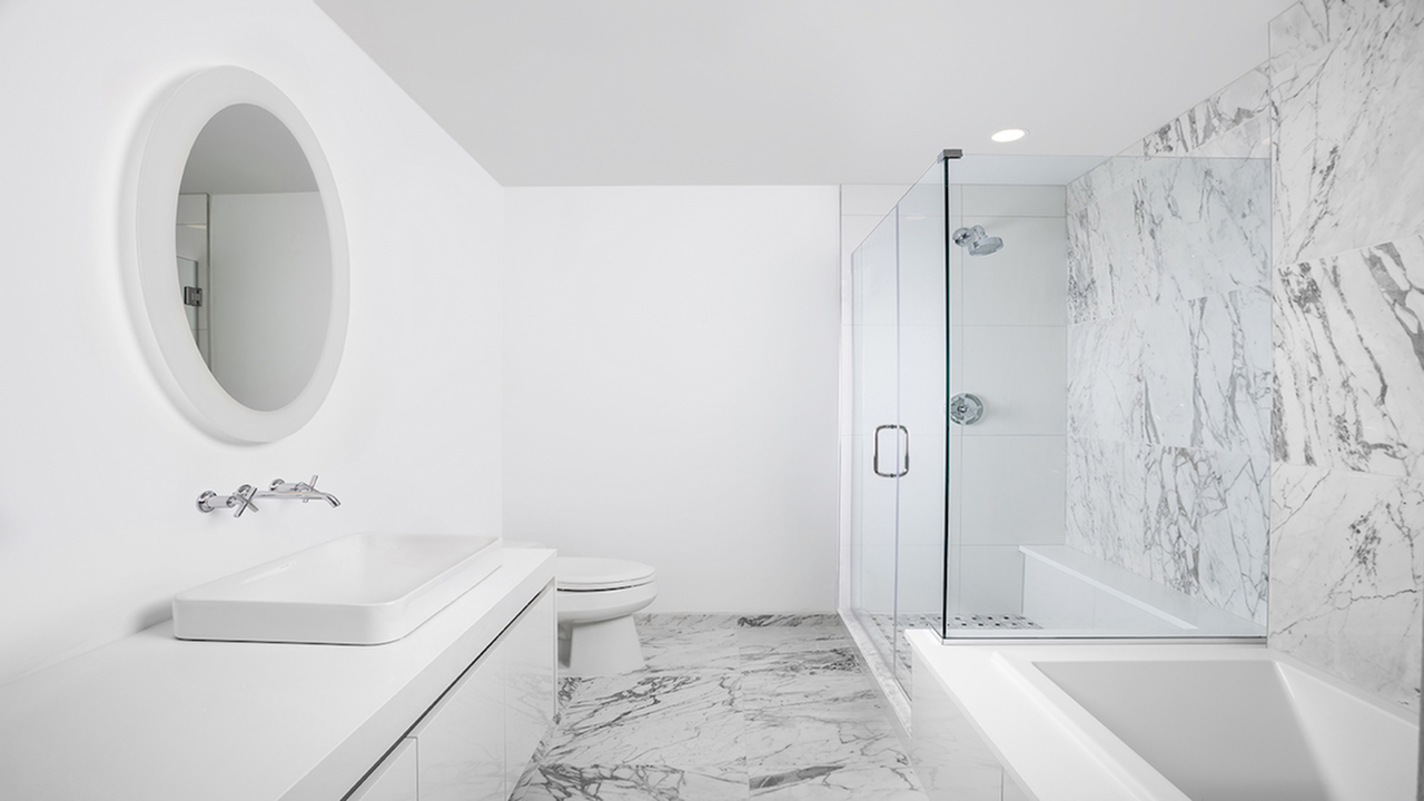 Spa Inspired Bathrooms featuring floor to ceiling marble for bath and shower