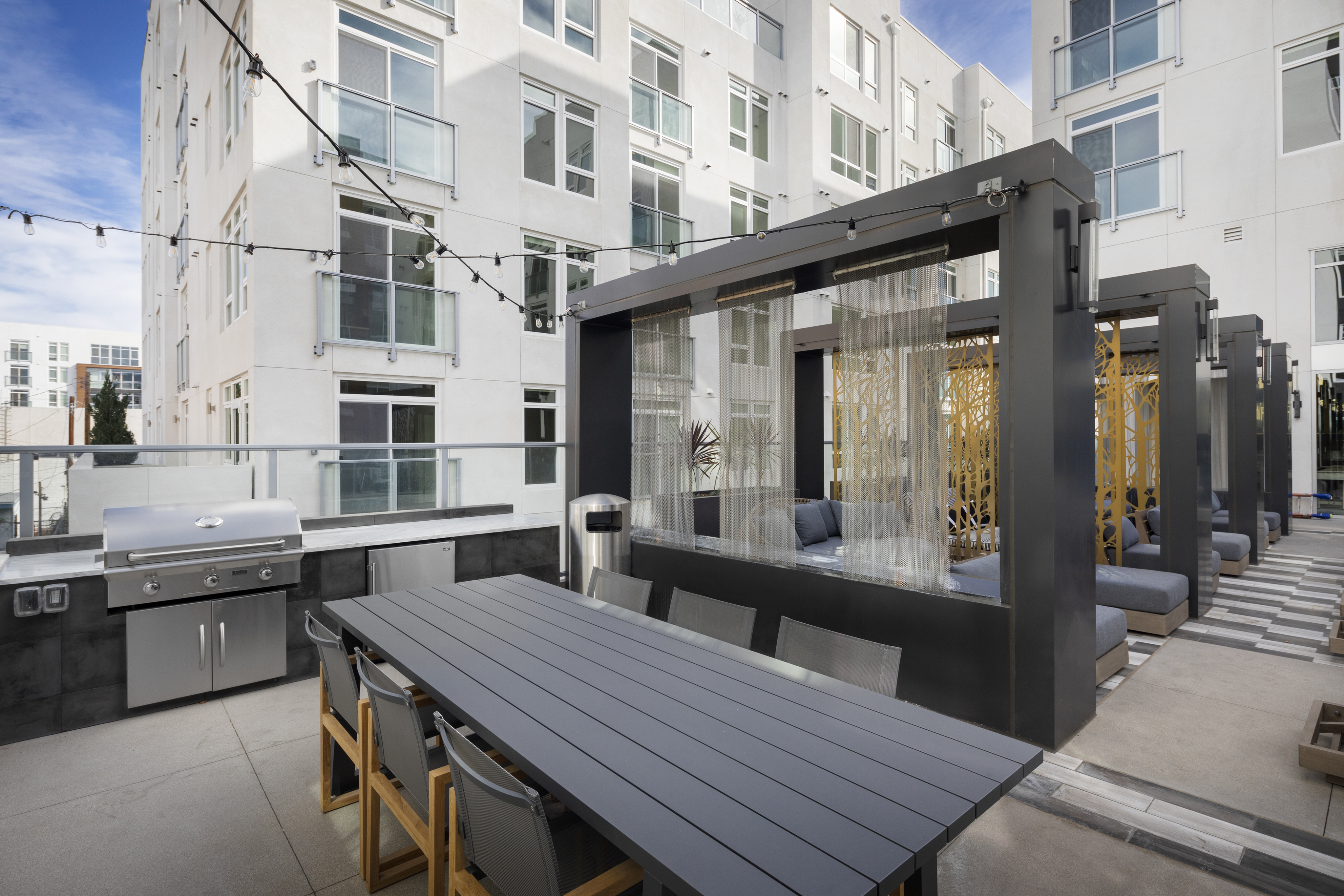 Seating on the rooftop with plenty of amenity space to host resident events