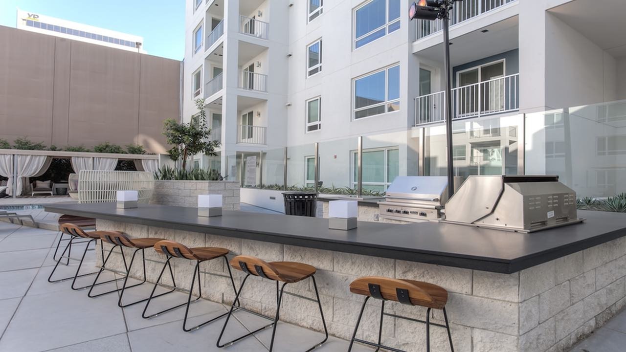 Outdoor grilling area with seated bar