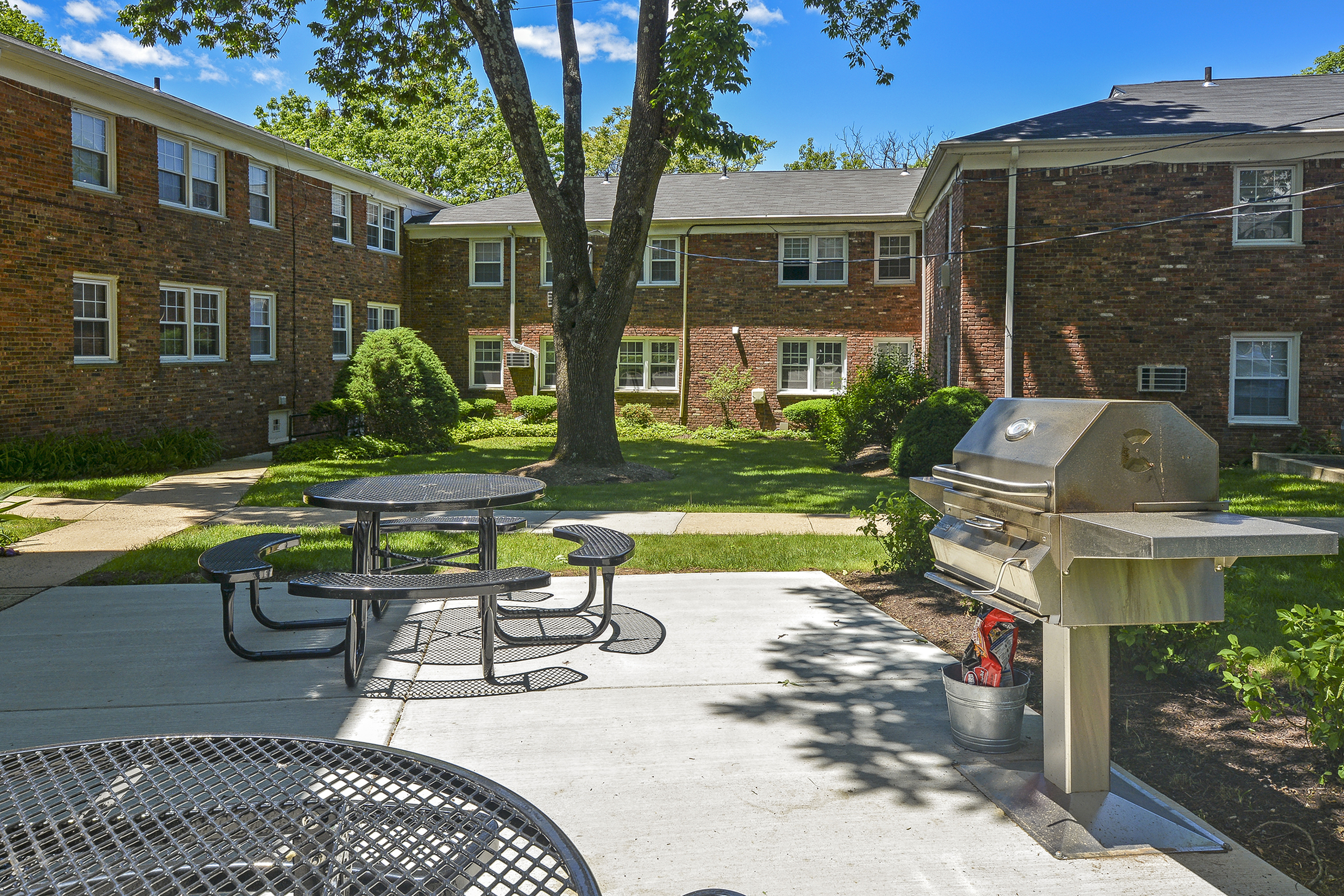 Wonderful barbeque and picnic areas within The Parc at Summit apartment grounds for residents in Summit, NJ