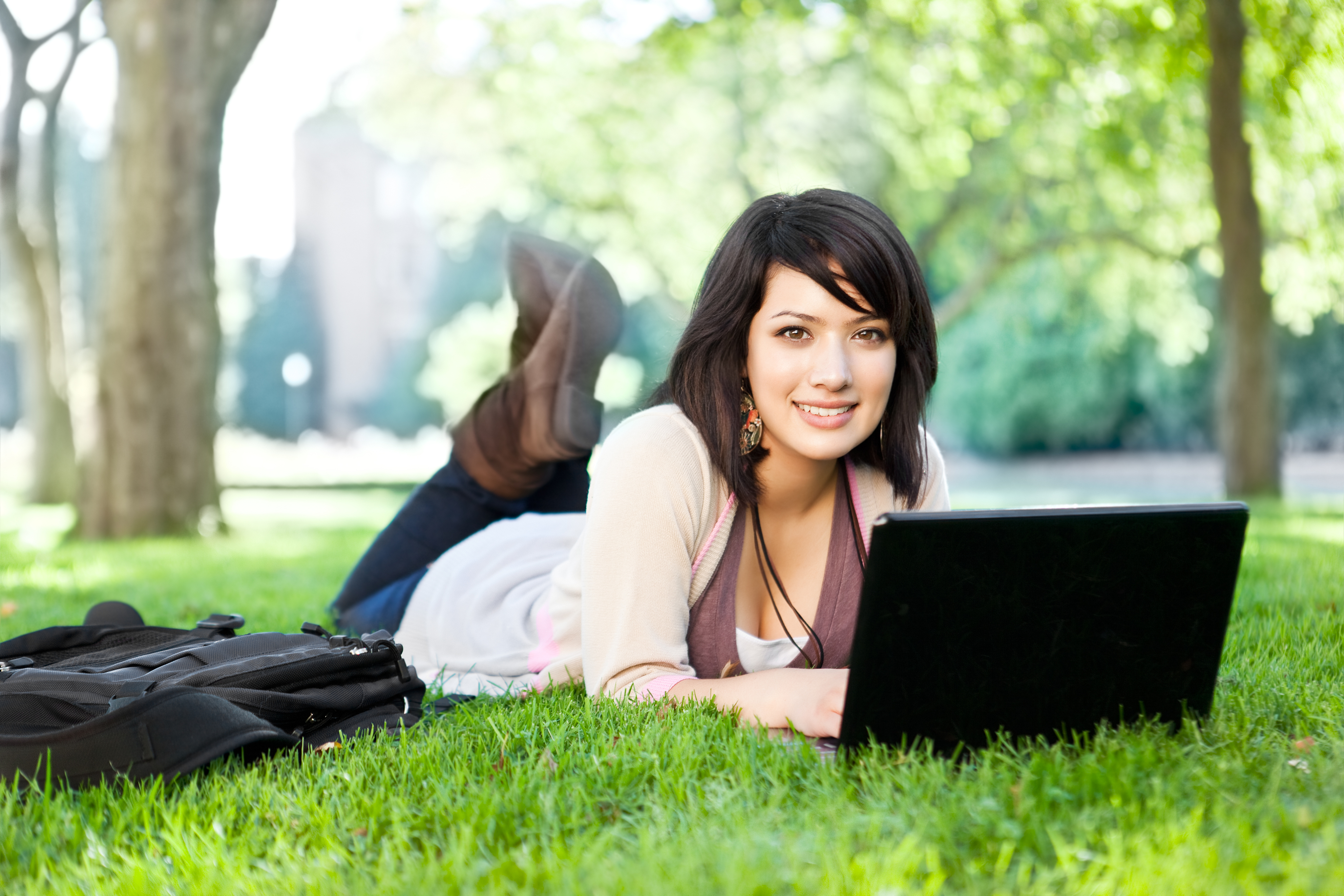 Student Studying on Lawn