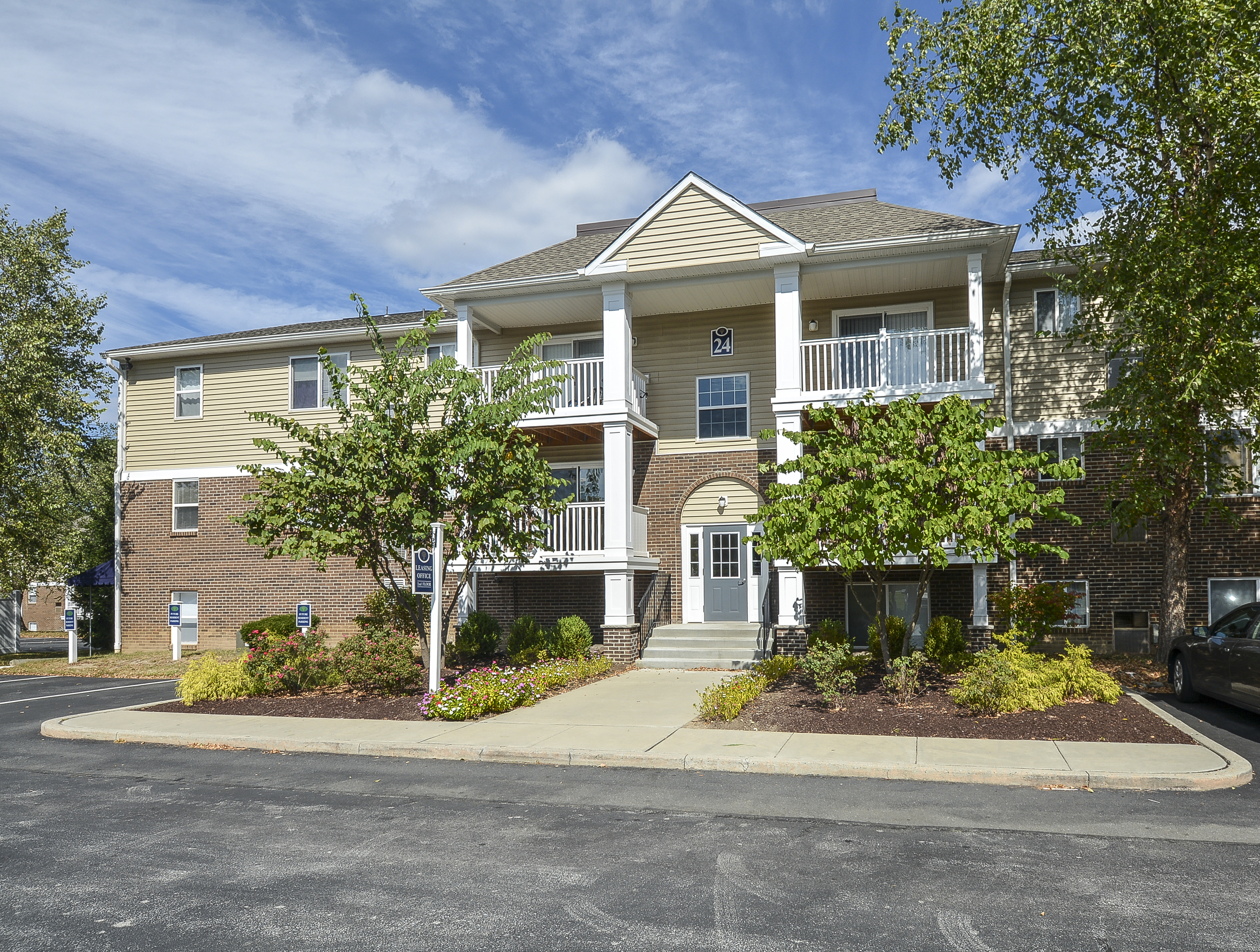 Glen Eagle Village Leasing and Management Office with Shrubs and Walkway | Newark Apartments Near DE