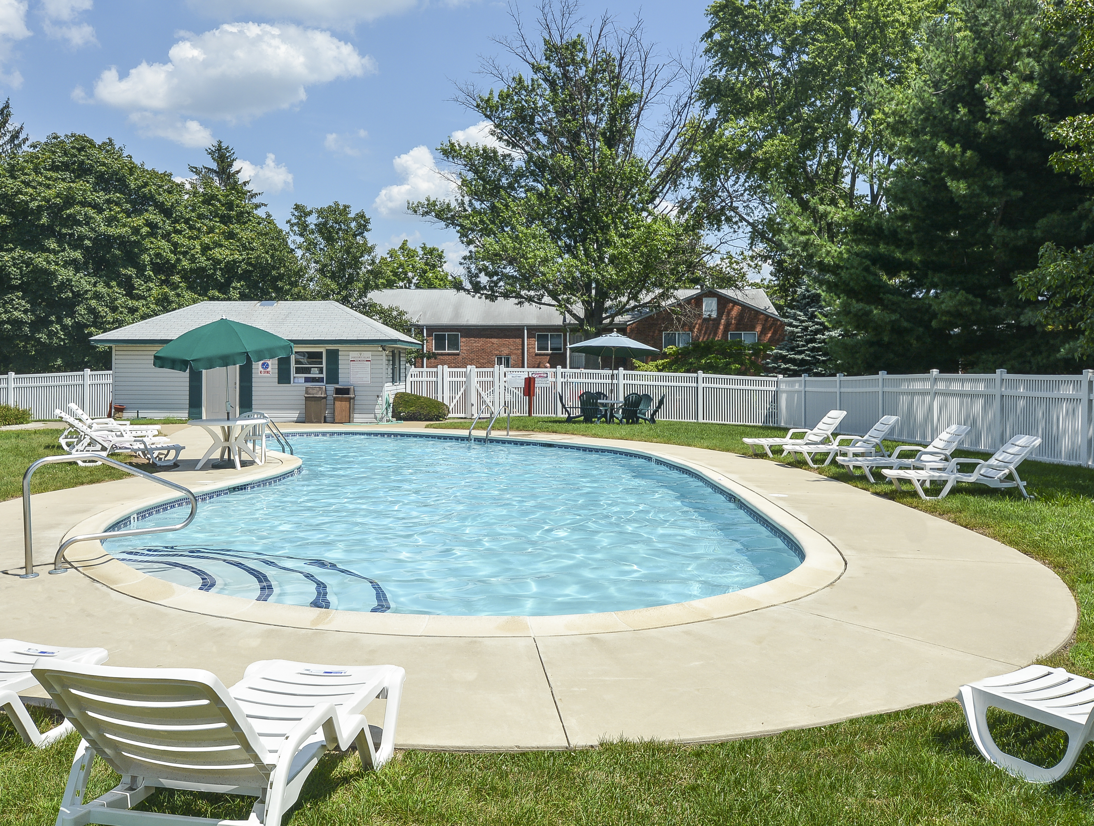 Jamestown Village Swimming Pool with White Chairs | Willow Grove, PA Apartments