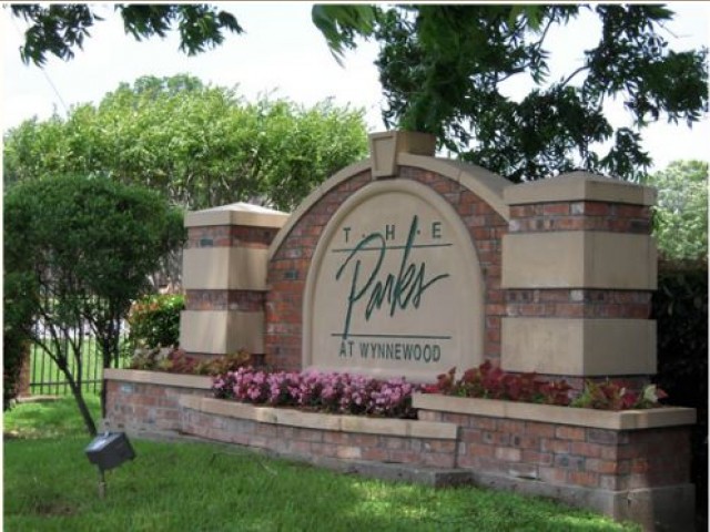Property Sign at Entry of Apartment Community