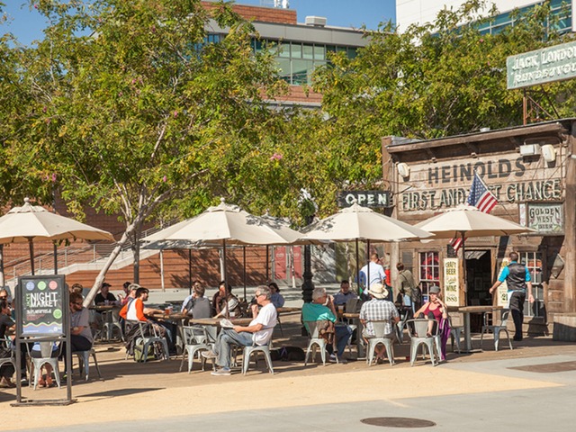 Image of people sitting outdoors at Heinold’s First and Last Chance Saloon