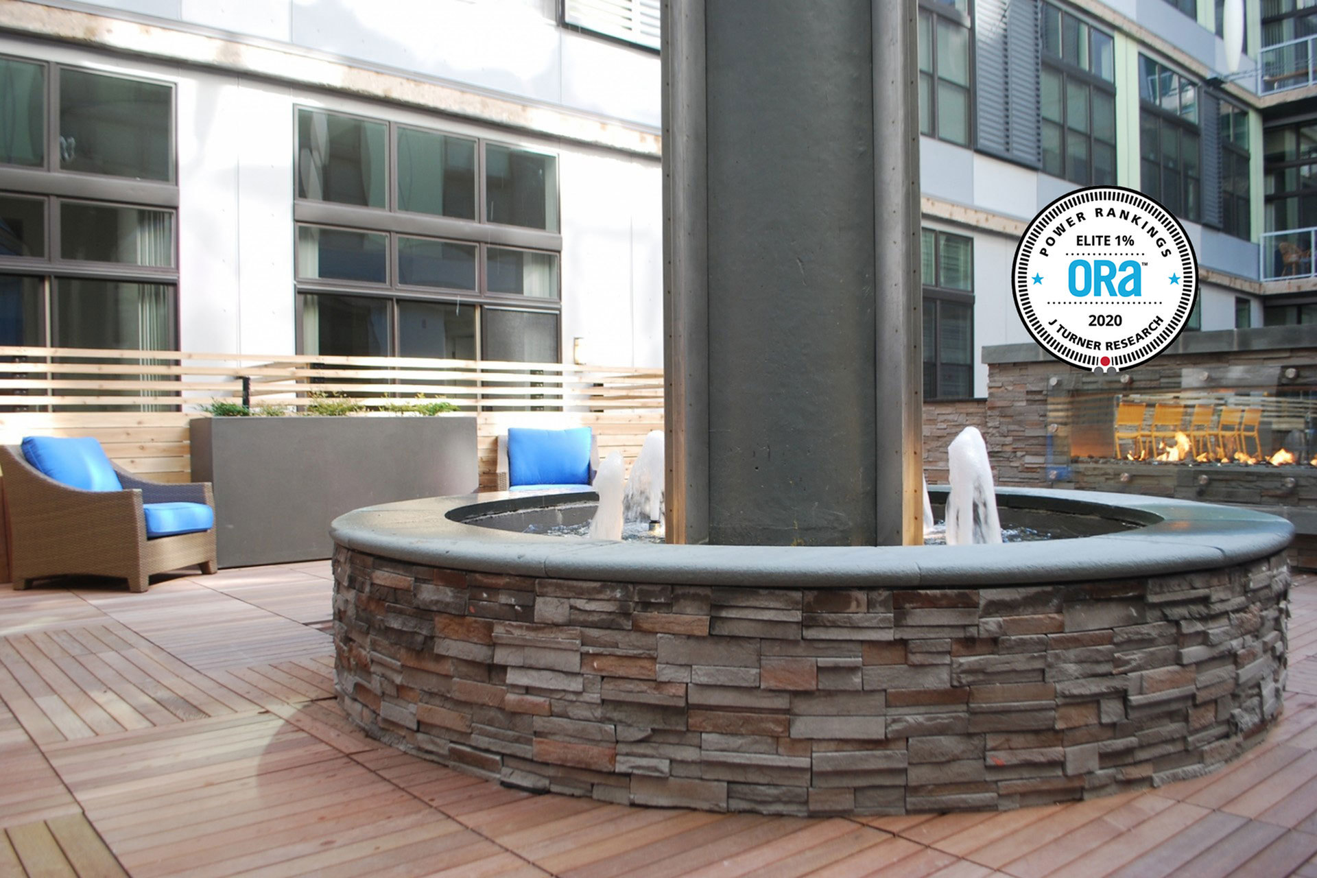 Resident Lounge with fountain, fire place, and chairs. ORA 2020 Power Rankings J Turner Research seal superimposed in the top right corner of the photo.