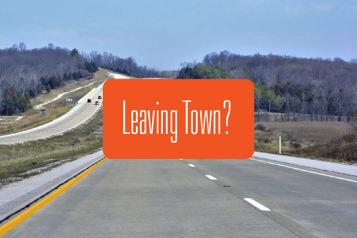 A photo of a midwestern(ish) interstate with an oragne rectangle that says 'Leaving Town?'
