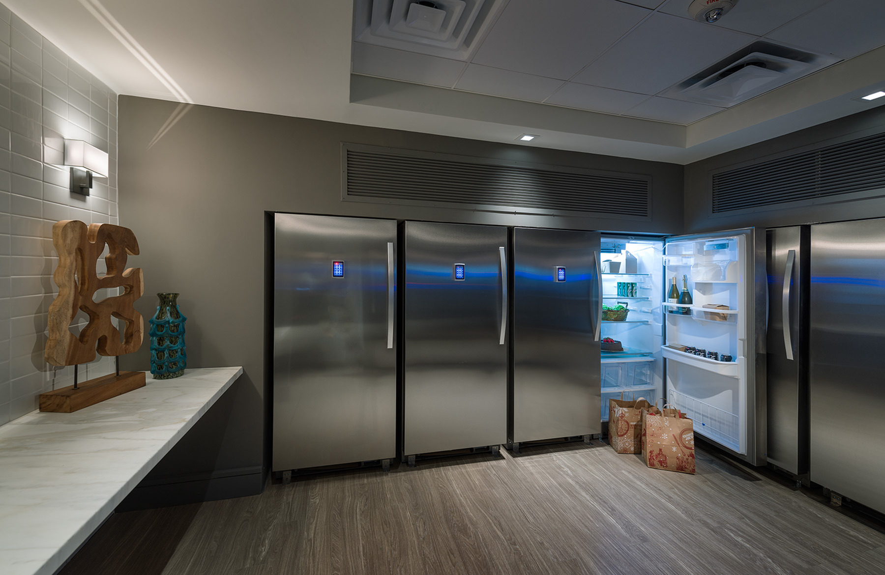 Convenient cold storage room with lockable fridge & freezers at Hanover Montrose