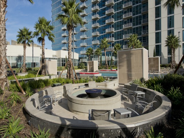Recreation deck with firepits, and outdoor dining and grilling areas at Hanover Hermann Park