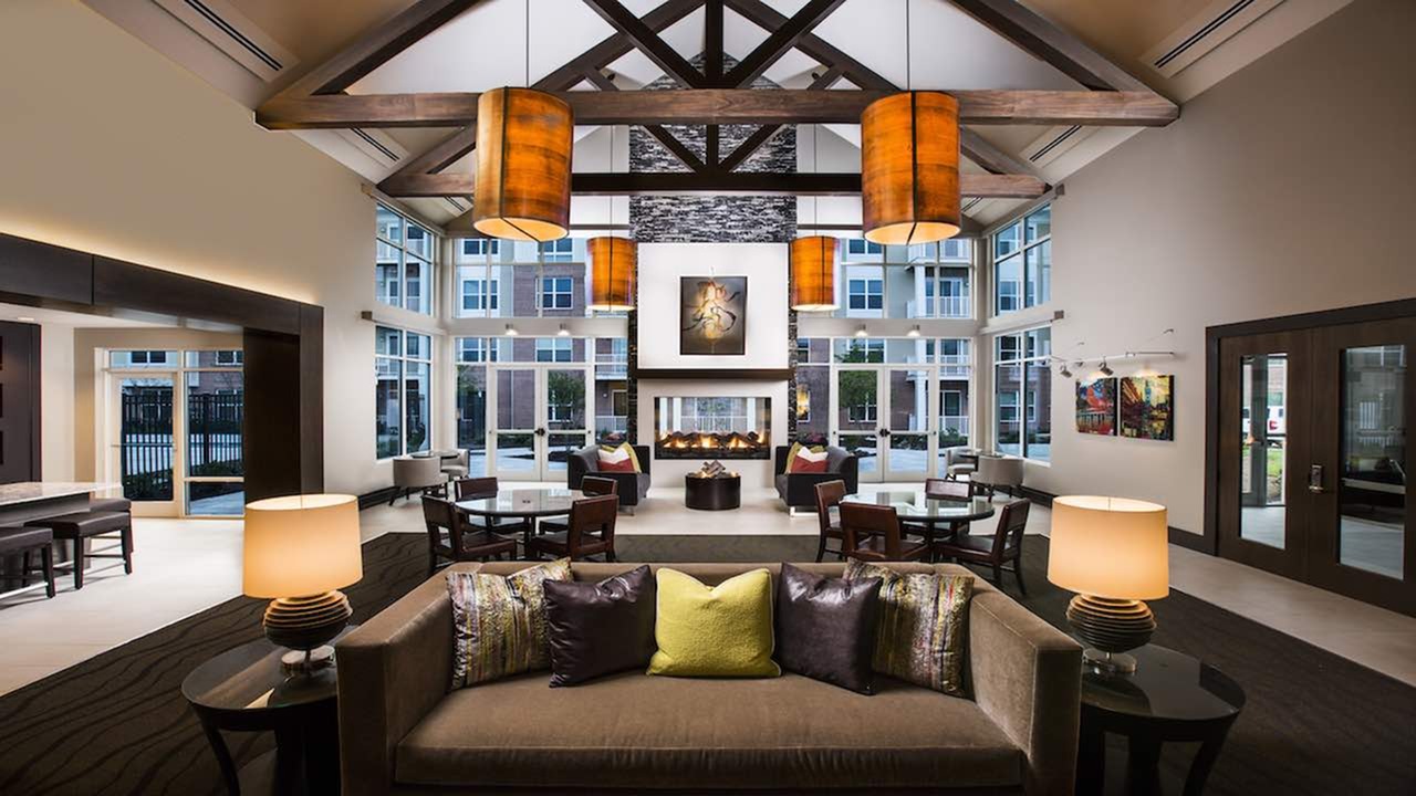 Resident lounge with double-sided fireplace and cozy ambiance. Resident lounge with double-sided fireplace and cozy ambiance.
