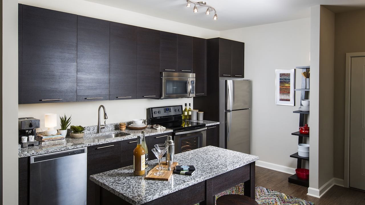 Movable kitchen islands and wood plank-style flooring. Movable kitchen islands and wood plank-style flooring.